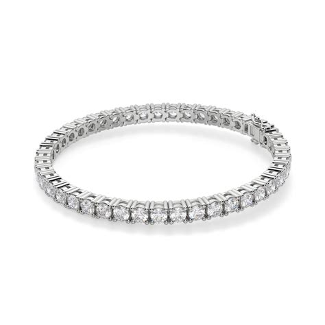 The tennis bracelet features glittering diamonds set in symmetrical, continuous links along the complete length of the metal chain. Bracelets | Tennis | Devon Bracelet