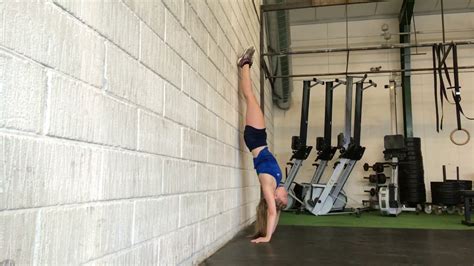 Handstand Push Up Against Wall Watchfit How To Perform Handstand