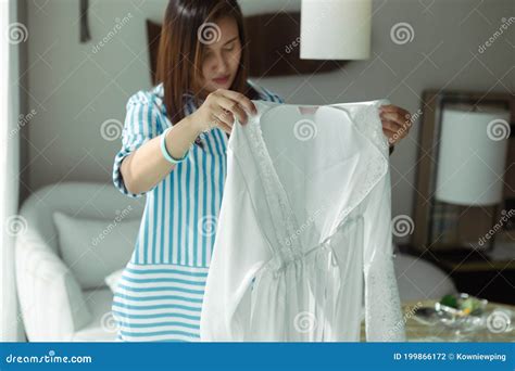 Woman Choosing Silk Robe Stock Photo Image Of Home 199866172