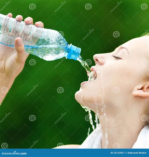 Woman Drinking Water After Exercise Royalty Free Stock Photography