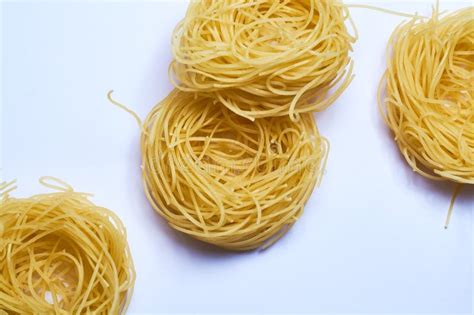 White Background And Thin Italian Noodles Spaghetti Pasta Of Wheat