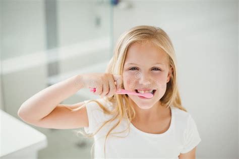Portrait Of Girl Brushing Teeth Stock Photo Image Of Brush