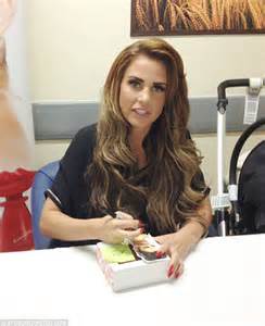 Katie Price Receives Warm Welcome From Bolton Fans As She Signs Bottles