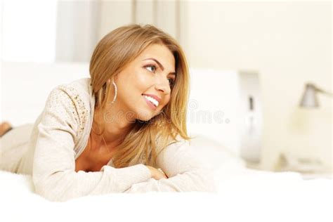 Young Beautiful Woman Lying On The Bed Stock Image Image Of Bedroom