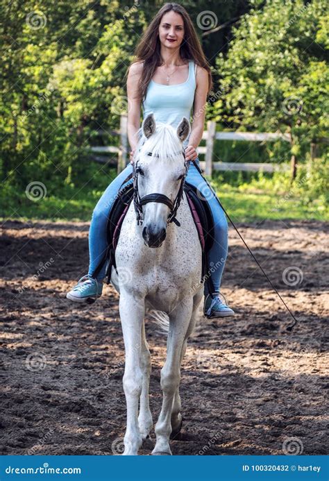 A Beautiful Girl Is Riding A White Horse Stock Photo Image Of Breed