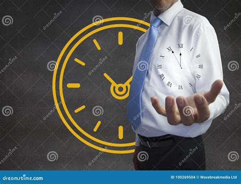 Business Man Holding A Clock Against Background With Clock Stock Photo