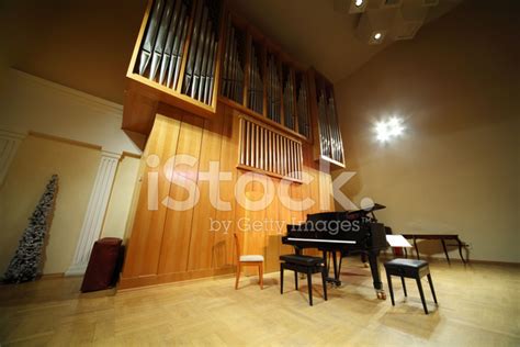 Massive Wooden High Pipe Organ And Black Concert Grand Piano Stock
