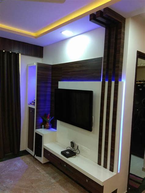 Hall showcase designs have very decorative ideas that can be incorporated. tv unit designs in the living room | Kumar Interior
