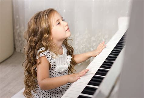 Beautiful Blond Little Girl Playing Piano Stock Photo Image Of