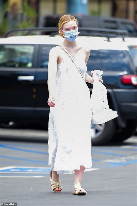 Elle Fanning Goes Chic In A Flowing White Dress As She Looks To Beat
