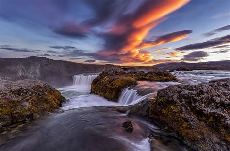 Sunset Clouds Over Waterfalls