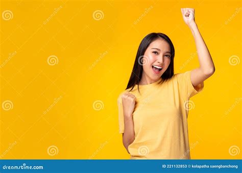 Happy Excited Young Asian Female With Raised Hands Celebrating Success