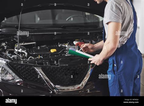 Portrait Of A Mechanic At Work In His Garage Car Service Repair