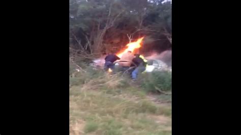 Dramatic Video Shows Bystanders Heroically Rescue Man From Burning Car