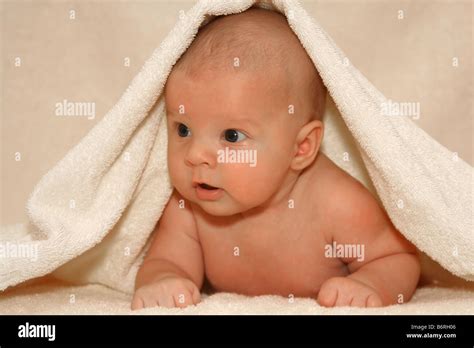 Newborn Baby Under Towel Stock Photo Alamy