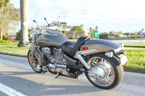 Black, candy orange, metallic silver, and bright blue metallic. 2005 Honda VTX 1800 F1
