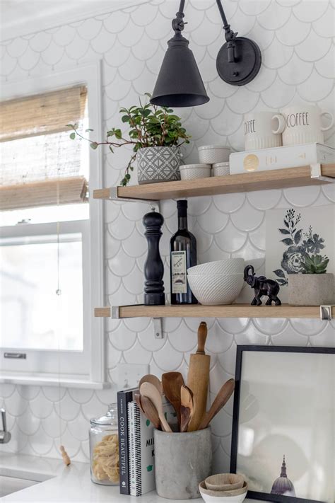 To reface your cabinets, you can choose from various materials and designs, resulting in a fresh look for a fraction of the cost (compared to newly installed cabinets). Scandinavian Kitchen refresh, scalloped backsplash tile, small scale appliances, two tone custom ...