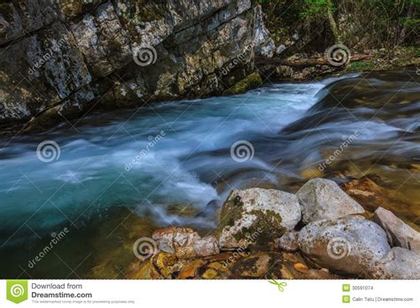 Mountain Stream And Waterfalls In The Forest In Spring Stock Photo