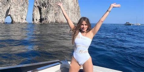 Sofia Vergara Lounges In A White Swimsuit With Sheer Lace Cutouts