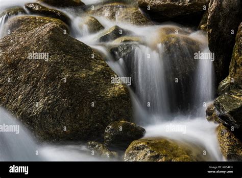 Fast Flowing Water In A Creek With Rocks In Austria Stock Photo Alamy