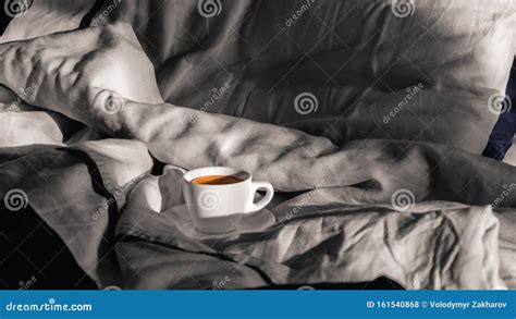 Morning Coffee In Bed White Cup Of Coffee On A Gray Bed Enjoying The