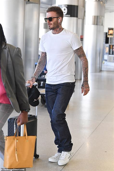 David Beckham Displays His Heavily Tatted Arms As He Arrives In Miami