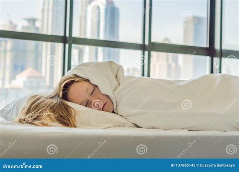 Woman Wakes Up In The Morning In An Apartment In The Downtown Area With A View Of The