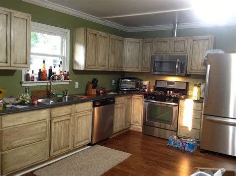 If the cabinets are stained or coated with a single layer of clear finish, you may not need to use paint stripper. White oak,gel stain cabinets Instead of kitchen bath room ...