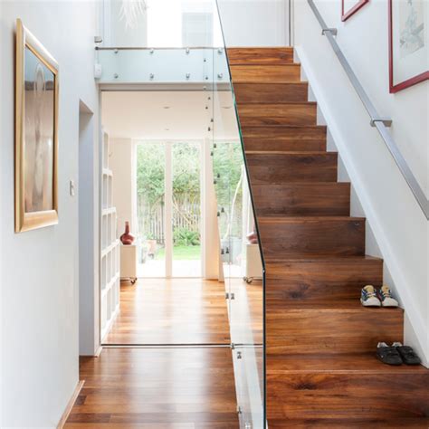 White Hallway With Walnut And Glass Staircase Hallway