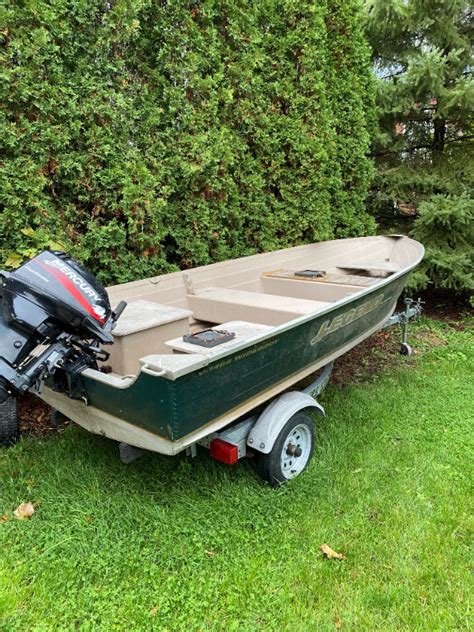 14 Ft Lund And 15 Hp Mercury And Trailer Powerboats And Motorboats