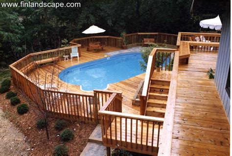 A Hillside Back Yard Including A Swimming Pool Multilevel Decks And
