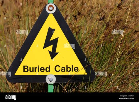 Yellow Buried Electrical Cable Warning Sign At A Quarry In The West