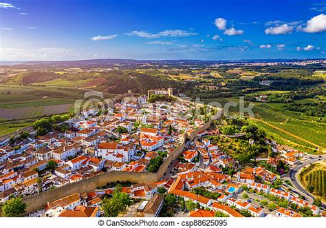 Aerial View Of The Historic Walled Town Of Obidos At Sunset Near