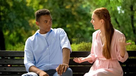 Mixed Race Boyfriend Ignoring Girl Sitting On Park Bench Quarrel