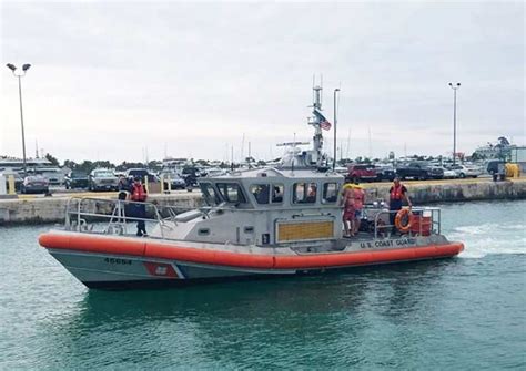 Coast Guard Rescues Three From Capsized Vessel Defense Media Network