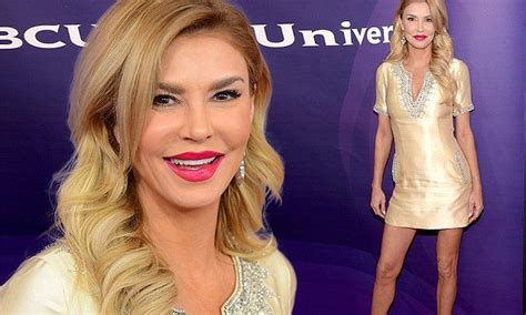 Brandi Glanville Flaunts Long Tanned And Toned Legs In Gold Mini Dress