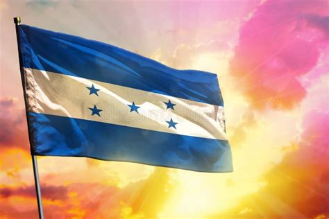 Fluttering Honduras Flag On Beautiful Colorful Sunset Or Sunrise
