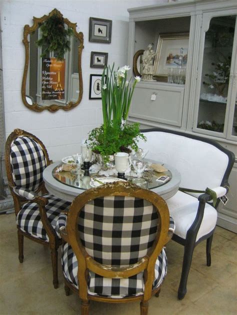 White wishbone chairs surround a brown reclaimed wood dining table placed beneath a white cage drum lantern. Elegant Dining for Two... | Cafe de Paris | Pinterest ...