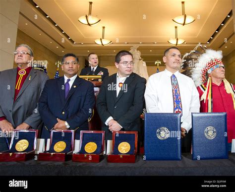 representatives of native american tribes stand during the congressional gold medal ceremony