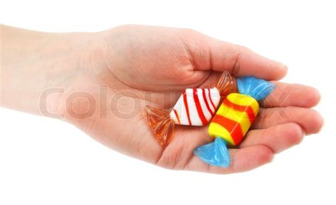 Womans Hand Gives Two Colored Candy Stock Image Colourbox