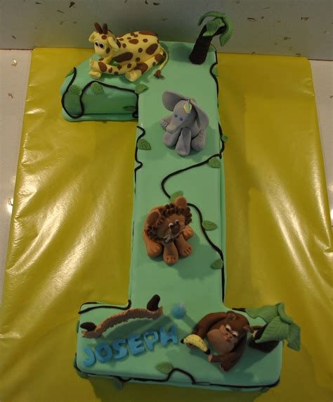 Fierce and fun ideas for baby shower decorations, favors, treats and more! Taylor Made Baking: Jungle Themed 1st Birthday Cake.