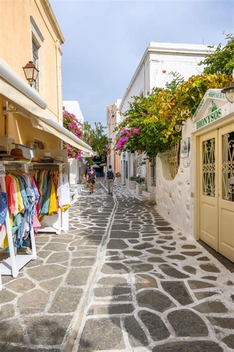 Greek Street With Whitewashed Pavement And Shops In Old Town Of Parikia