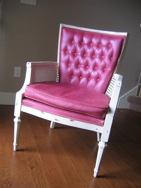 A french bergere chair stands below the desk with a pink back and brown seat trimmed with pink piping over a black and white zebra print rug. This, That and Life: The "Official" Painted Pink Chair ...