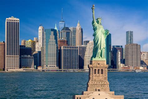 Statue Of Liberty And New York City Skyline With Skyscrapers Of