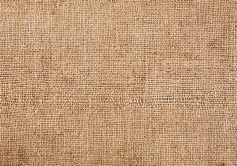 Brown Burlap Laying On White Sheet Abstract Background Texture Of