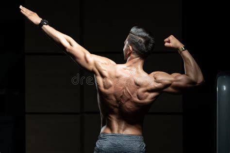 Muscular Man Flexing Back Muscles Pose Stock Photo Image Of Build