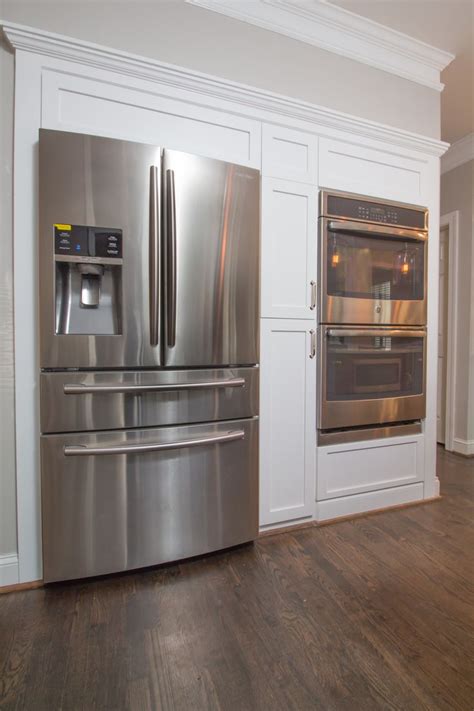 Kenmore is a popular brand of household and kitchen appliances that are sold by sears, roebuck and, co. New fridge and double oven wall with Shaker style panels ...