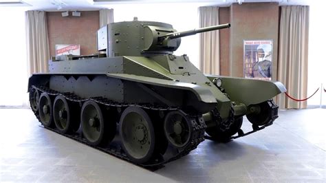 An Old Tank Is On Display In A Museum