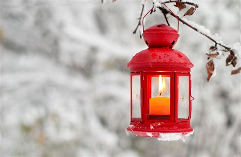 Winter Red Lantern With A Candle Attached To The Tree Covered With Snow