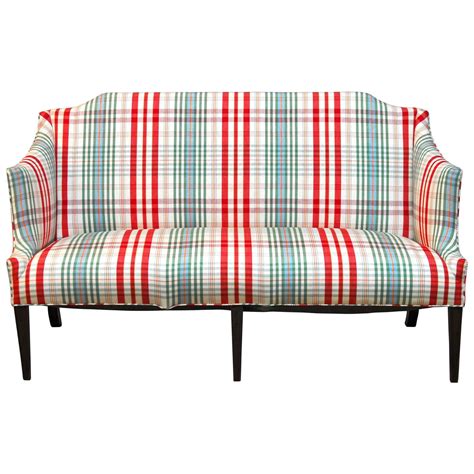 Interesting details include highly stylized sleek metal legs and stabilizing sofa base. Modern Sheraton Style Plaid Settee Sofa at 1stdibs